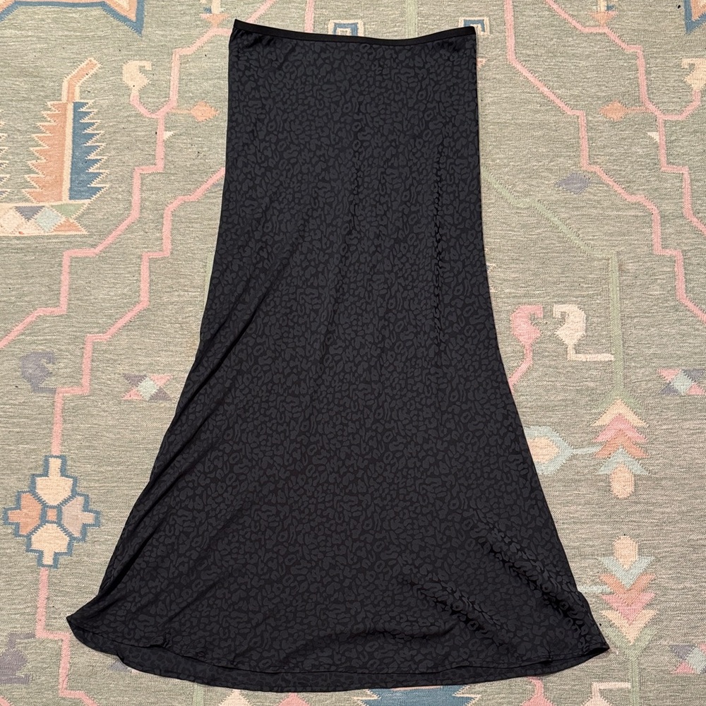 Slinky black on black leopard print midi skirt